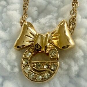 Givenchy “G” rhinestone Gold Bow Pendant Necklace. Perfect condition.